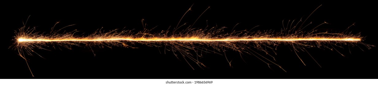 Sparkler trail of light with sparks in a straight line. - Shutterstock ID 1986656969
