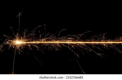 Sparkler trail of light with sparks in a straight line - Powered by Shutterstock