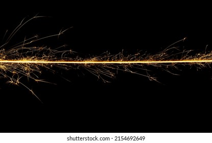 Sparkler Trail Of Light With Sparks In A Straight Line