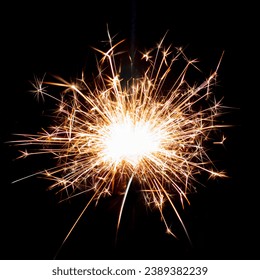 Sparklers on black isolated background. Sparks from a burning sparkler. To insert an image in a blend mode - Shutterstock ID 2389382239
