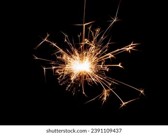 Sparklers on black isolated background. Sparks from a burning sparkler. To insert an image in a blend mode - Shutterstock ID 2391109437