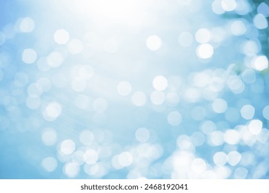 SPARKLING BOKEH LIGHTS BACKGROUND WITH SUN LIGHT ON BLUE, BLURRY BACKDROP - Powered by Shutterstock