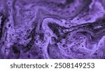 Sparkling fluid flow. Shimmering liquid gel. Abstract emulsion with small bubbles paint purple acrylic amethyst color gloss mix wave background.