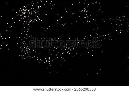 Sparkling golden lights on a dark background create a festive atmosphere.