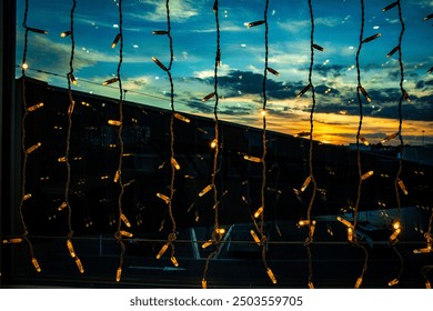 Sparkling led yellow lights running vertically. A curtain of Christmas fairy lights. Fairy light strips - Powered by Shutterstock