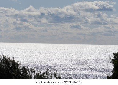 Sparkling Ocean With Low Clouds