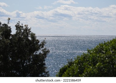 Sparkling Ocean With Low Clouds