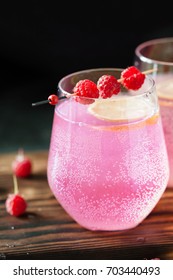 Sparkling Pink Raspberry Lemonade On Dark Background Close Up