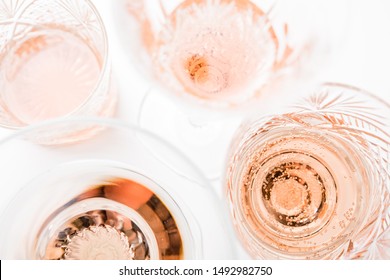 Sparkling Rose Wine In Different Glasses On White Background