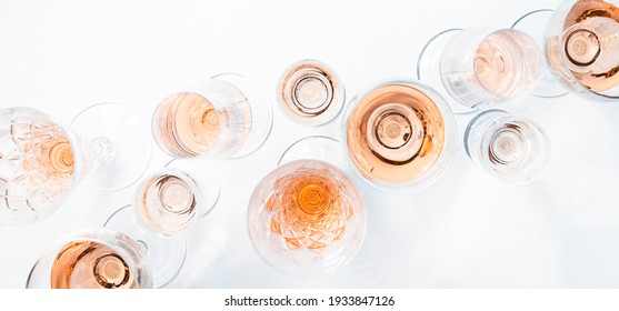 Sparkling Rose Wine In Different Glasses On White Background.