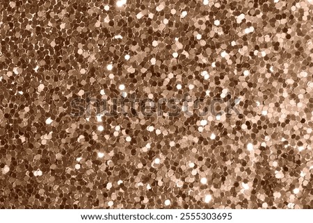 A sparkling surface of hexagonal bronze sequins reflecting light, creating a shimmering pattern. Ideal for festive backgrounds, design elements, or abstract art. Demonstrating color of 2025 year.