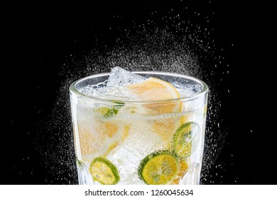 Sparkling Water With Lime And Lemon On Black Background