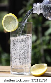 Sparkling Water Pouring Into Glass