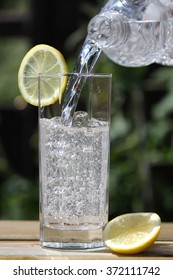 Sparkling Water Pouring Into Glass