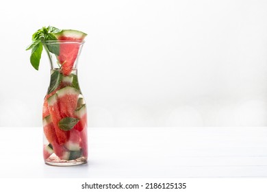 Sparkling Watermelon Water With Green Basil In Glass Jar. Copy Space. White Background.