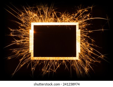 Sparkly glowing empty rectangle frame with copy space on dark background.