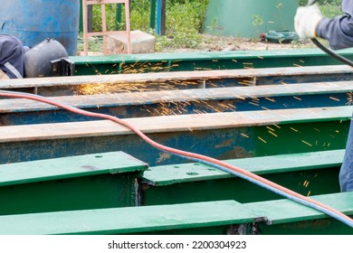 Sparks From Cutting Steel.welding Or Gas Welding. And Oxy-fuel Cutting Are Processes That Use Fuel Gases And Oxygen To Weld And Cut Metals, Respectively.