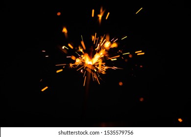 Sparks in the dark. Sparks. Christmas and New Year time. Magic light - Shutterstock ID 1535579756