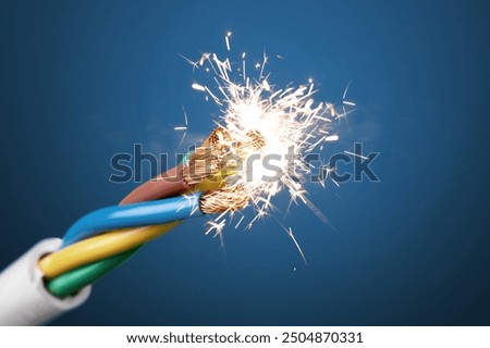 Sparks explosion at electrical cables, fire hazard concept