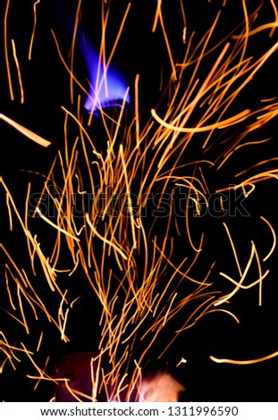 Sparks and glowsticks over a bonfire near lake Huron. The Pinery, Ontario. January 2016