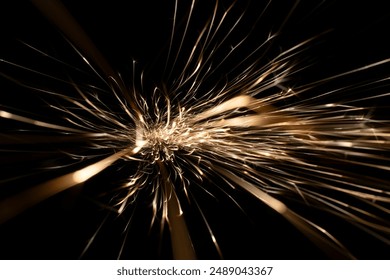 sparks from the grinder glowing in the dark straight ahead - Powered by Shutterstock