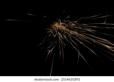 sparks from the grinder glowing in the dark straight ahead - Powered by Shutterstock