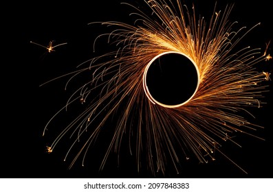 Sparks from steel wool on a background of the night sky. Long exposure. - Powered by Shutterstock