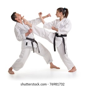 Sparring.Sport.Karate.Training fight.two fighters on a white background