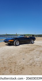 Sparrows Point MD - October 16 2021: Miami Black Convertible Daytona Spyder 365 Luxury Exotic Sports Car At Beach