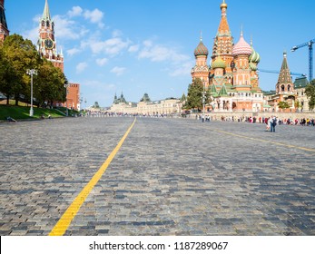 Spasskaya Clock Tower and Saint Basil Cathedral on Vasilevsky Descent in Moscow city in sunny september day
