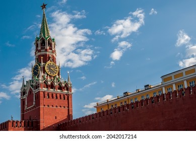 Spasskaya Tower Of The Moscow Kremlin. Moscow Chimes Against The Background Of A Blue Sky With Clouds.