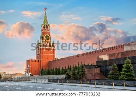 The Spasskaya Tower of the Moscow Kremlin on Red Square, illuminated by the rays of the setting sun of summer