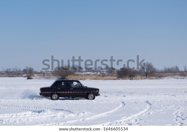 Spassk-Dalny, Primorsky Krai, Russia-2020 February
8: car starts on the track on the lake in amateur competitions on
snow rally
