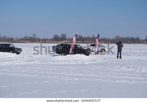 Spassk-Dalny, Primorsky Krai, Russia-2020 February\
8: car starts on the track on the lake in amateur competitions on\
snow rally