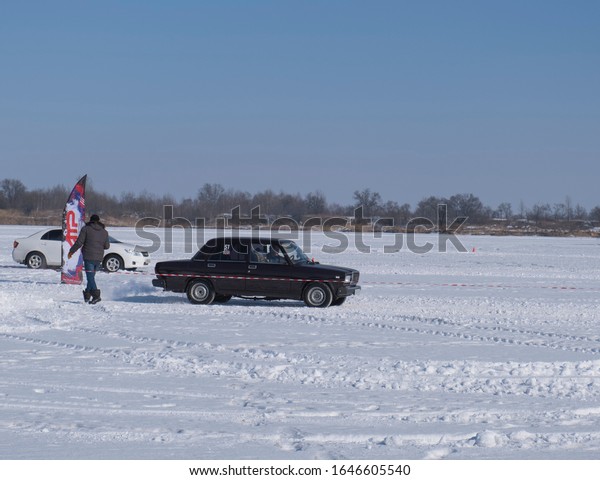 Spassk-Dalny, Primorsky Krai, Russia-2020 February\
8: car starts on the track on the lake in amateur competitions on\
snow rally