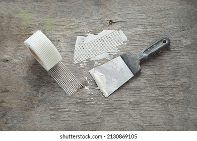 Spatula And Putty. Fiberglass Drywall Tape.