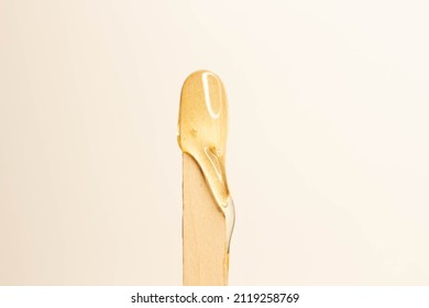 Spatula And Sugar Paste.Shugaring With Sugar. Waxing. Depilation With Hot Wax. Sugar Paste Flows Down A Wooden Spatula.