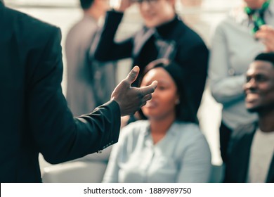 speaker asks questions to the participants of the business seminar - Shutterstock ID 1889989750