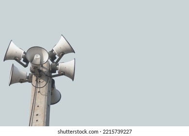 Speaker broadcasting on the technology pole isolated from broadcasting technology background. 