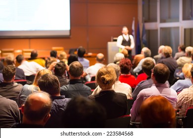 Speaker At Business Conference And Presentation. Audience At The Conference Hall. Business And Entrepreneurship.