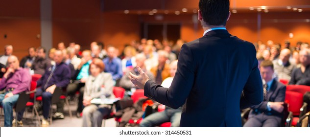 Speaker at Business Conference and Public Presentations  Audience at the conference hall  Entrepreneurship club  Rear view  Panoramic composition  Background blur 