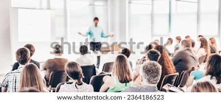 Speaker at business workshop and presentation. Audience at the conference room.