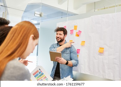 Speaker or consultant in consulting in a brainstorming workshop with sticky notes - Shutterstock ID 1761159677