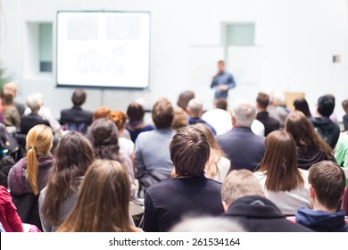 Speaker Giving Talk at Business Meeting  Audience in the conference hall  Business   Entrepreneurship  Copy space white board 