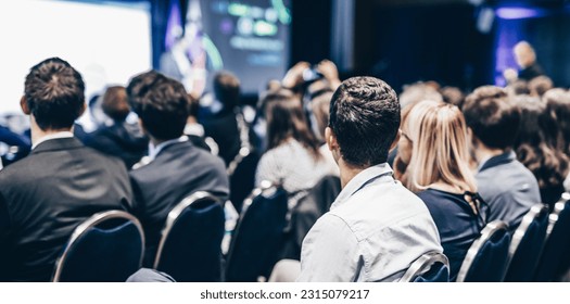 Speaker giving a talk in conference hall at business event. Rear view of unrecognizable people in audience at the conference hall. Business and entrepreneurship concept - Shutterstock ID 2315079217
