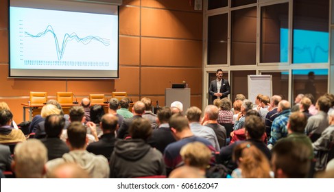 Speaker Giving A Talk In Conference Hall At Business Event. Audience At The Conference Hall. Business And Entrepreneurship.