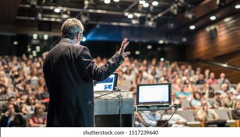 Speaker giving a talk on corporate business conference. Unrecognizable people in audience at conference hall. Business and Entrepreneurship event. - Shutterstock ID 1517239640