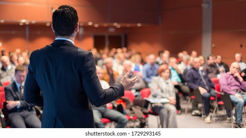 Speaker giving talk corporate business conference  Unrecognizable people in audience at conference hall  Business   Entrepreneurship event 