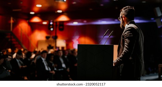 Speaker giving a talk on corporate business conference. Unrecognizable people in audience at conference hall. Business and Entrepreneurship event. - Shutterstock ID 2320052117