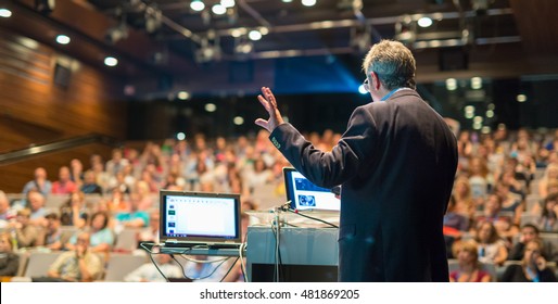 Speaker giving a talk on corporate Business Conference. Audience at the conference hall. Business and Entrepreneurship event. - Shutterstock ID 481869205